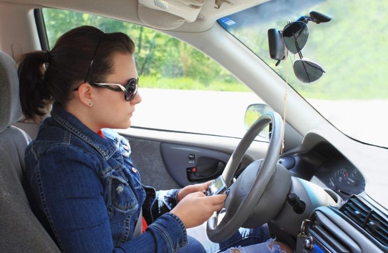 Woman texting while driving