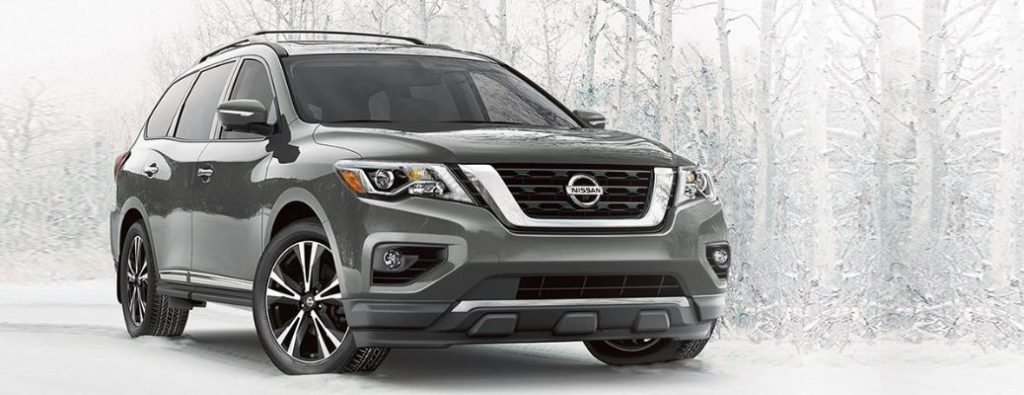 2020 Nissan Pathfinder parked in a snowy forest