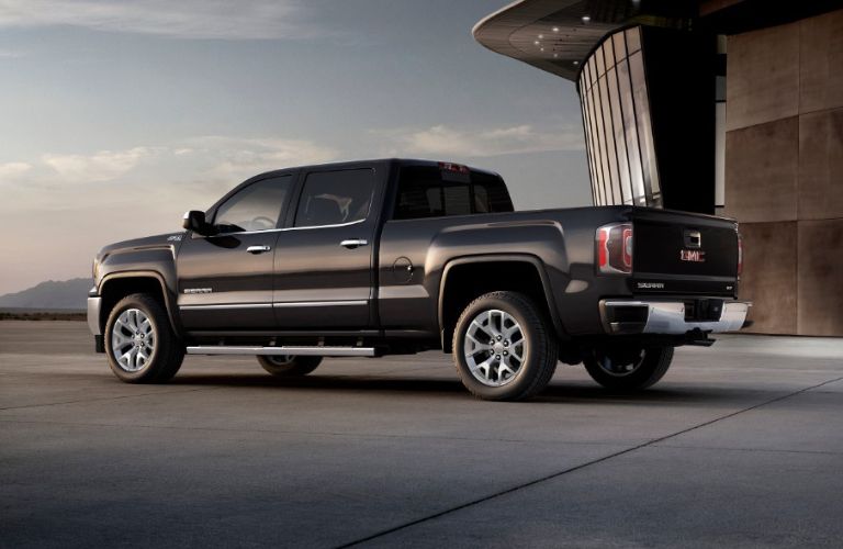 Rear three-quarter view of the 2018 GMC Sierra parked