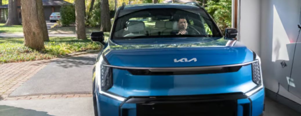 front view of a Kia parked in a garage