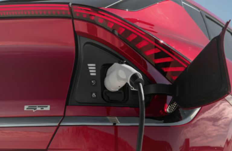 close up of a Kia EV getting charged