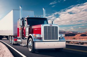 red peterbilt 589 on the highway