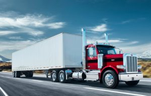 red peterbilt 589 on the highway