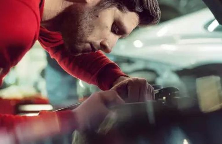 Person working on a vehicle