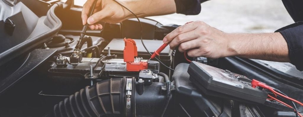 car engine battery being serviced