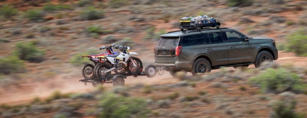 2025 Ford Expedition Tremor towing bikes in sand