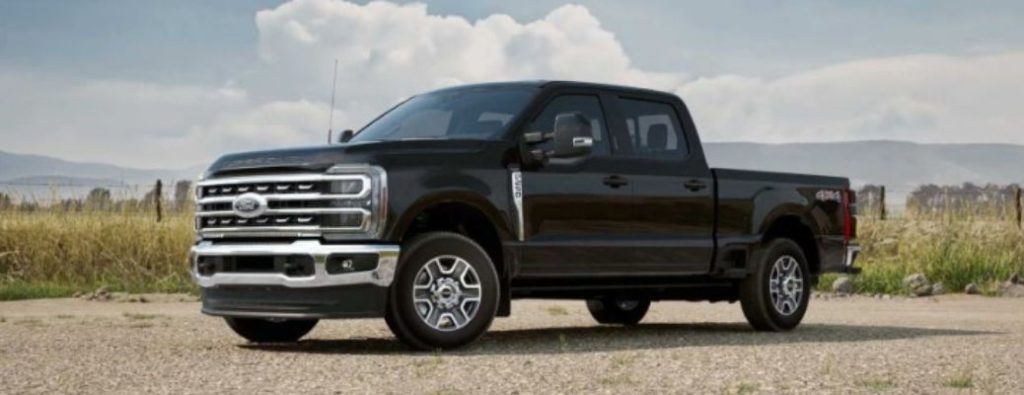 2025 Ford Super Duty side and front view on a beach