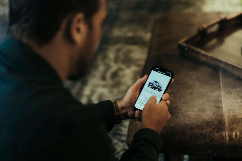 A man using the FordPass app, which is part of Ford's ongoing software strategy