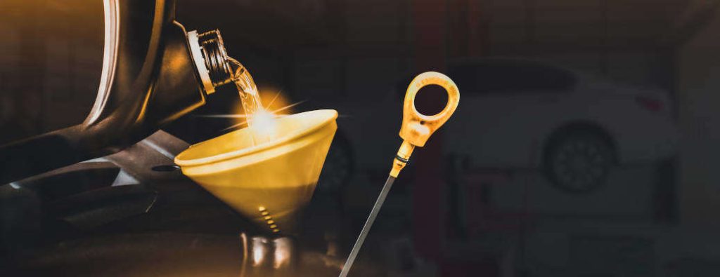 Mechanic pouring motor oil to engine with copy space on black background,Double exposure concept