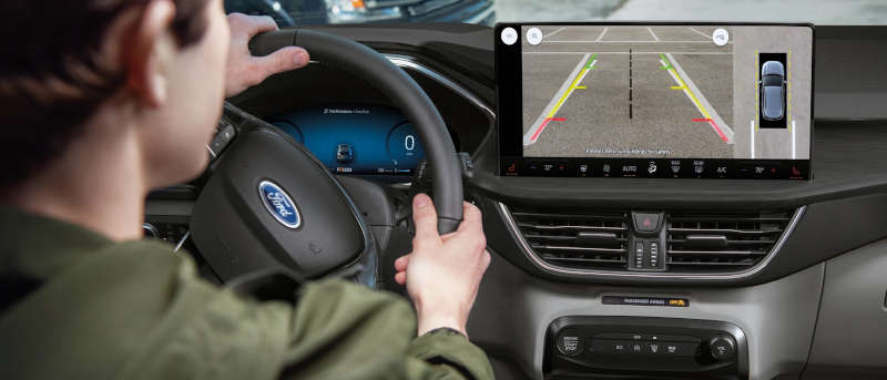 A man using the backup camera in the 2025 Ford Escape