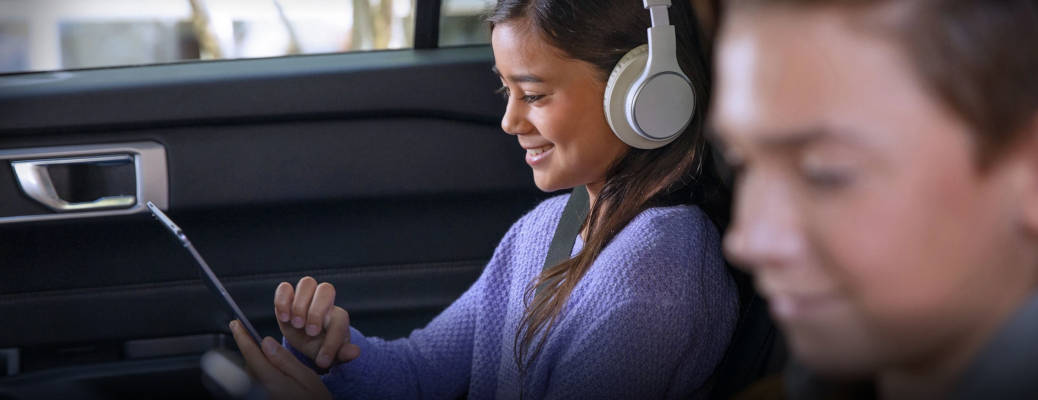 Kids enjoying in-car WiFi in a Ford vehicle