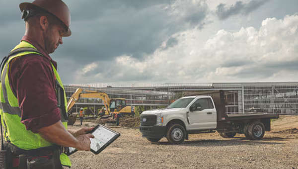 A man using Ford Pro™ Telematics to manage his construction fleet