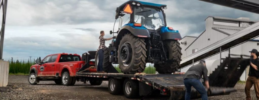 2026 Ford Super Duty towing a tractor