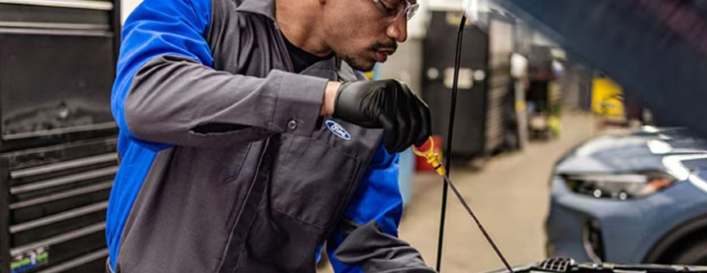 a man performing an oil change