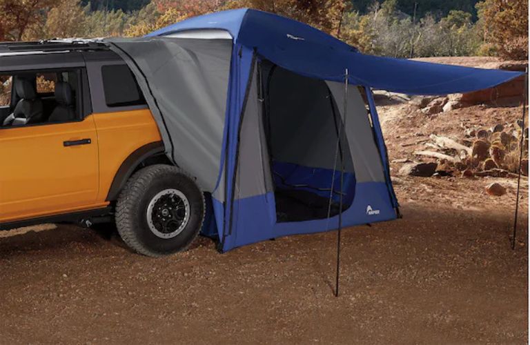 a Ford Bronco Sport with a rear tent