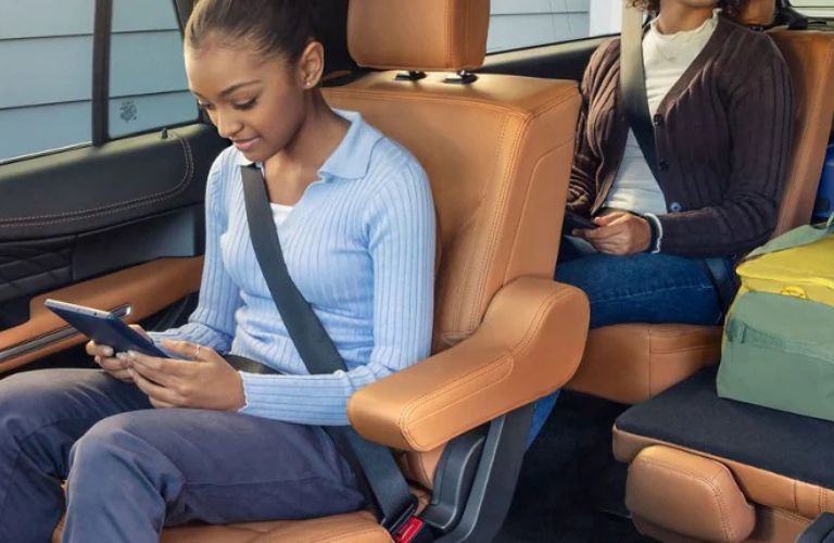 a person in a Ford vehicle on a tablet