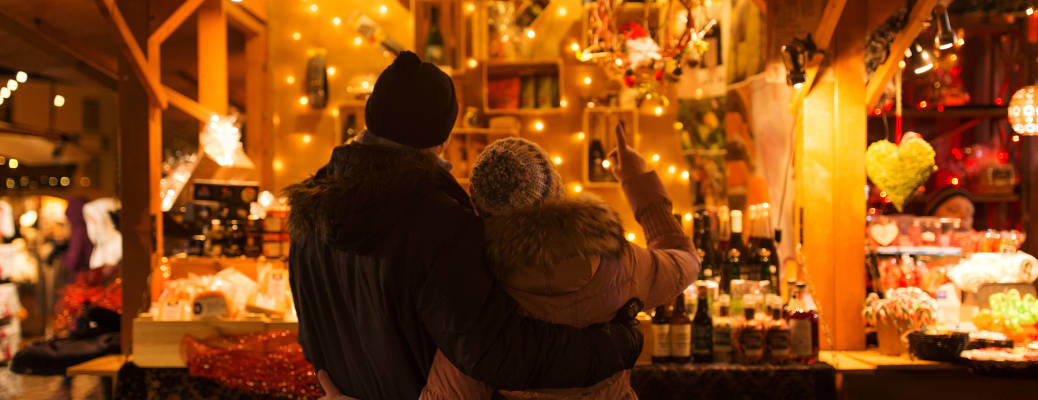 A couple enjoying a Christmas market, one of the Best Christmas 2025 Activities near Atlanta