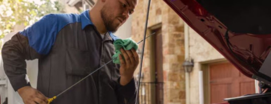 a man performing service on a vehicle