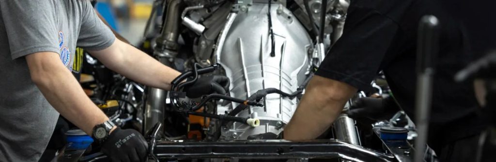 a Ford assembly plant with two workers