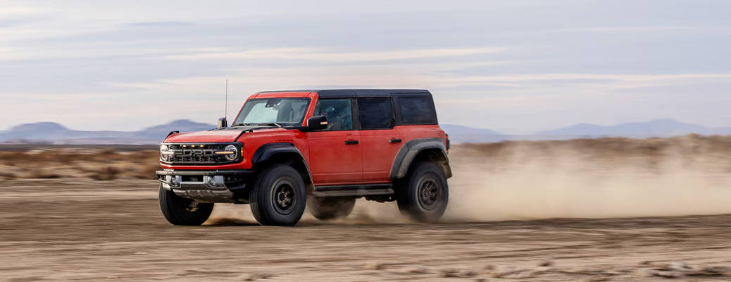 The 2026 Bronco Raptor with HOSS 4.0 Suspension off-roading in the desert