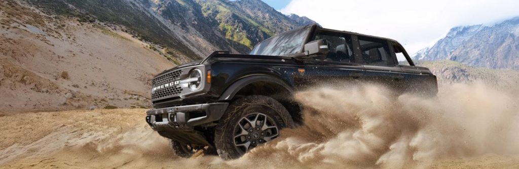 2026 Ford Bronco driving on dirt trail