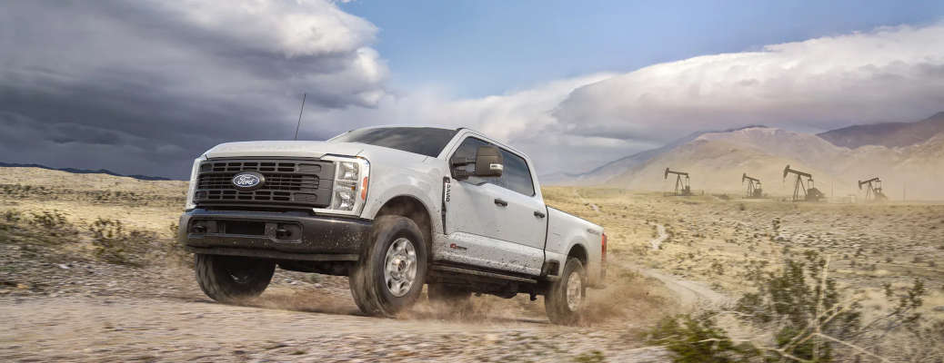 A side external view of the 2027 Ford Super Duty off-roading in the desert