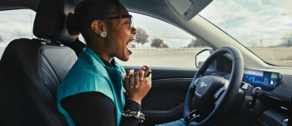 A woman enjoying the hands-free experience of Ford BlueCruise on the Georgia freeways.