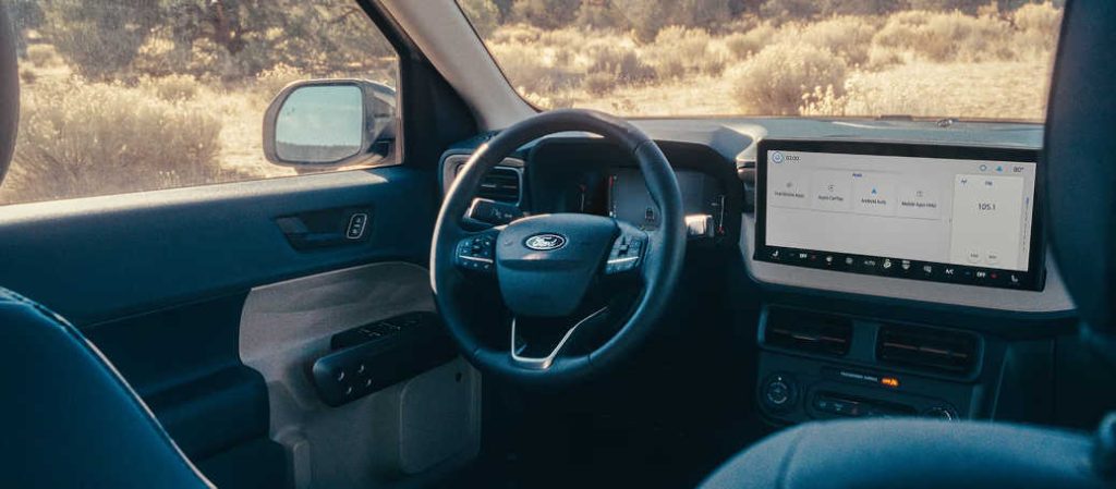The high-tech cockpit, controls, and infotainment system in the new 2026 Ford Maverick AWD hybrid.