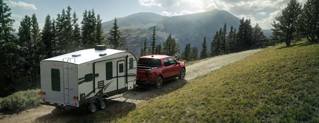 The versatile 2026 Ford Maverick AWD Hybrid towing a camper trailer on the Georgia backroads