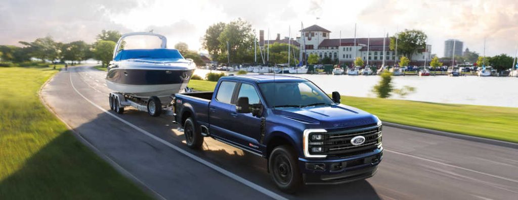 A Super Duty Ford truck towing a large boat near Winder, GA.