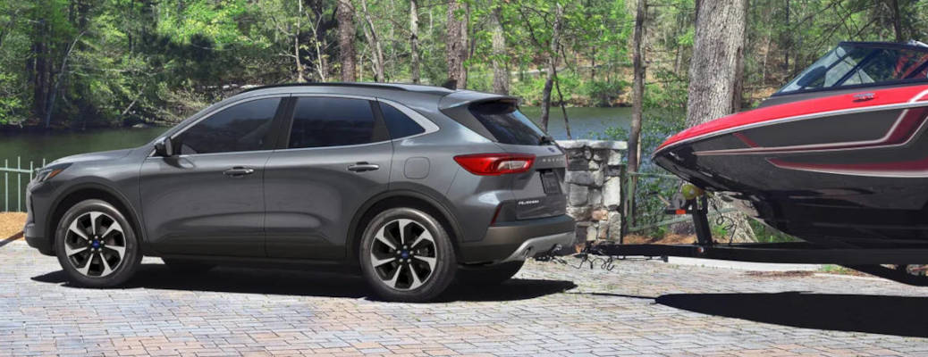 A Ford Escape Platinum towing a boat near Winder, GA