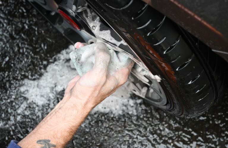 technician cleaning a car