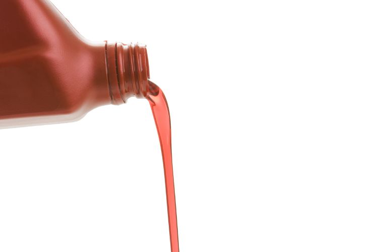 representative image of transmission fluid being poured