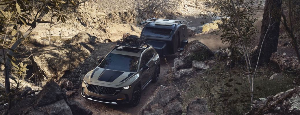 front view of the 2025 Mazda CX-50 towing a trailer