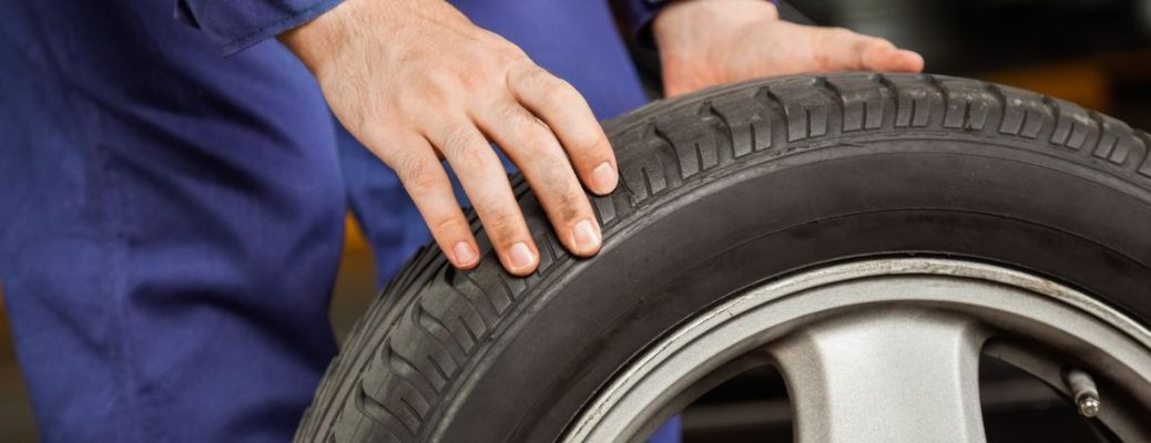 Technician checking a tire