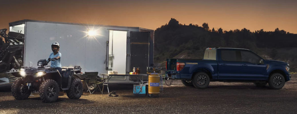 A side view of the Ford F-150 towing a large trailer