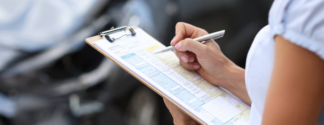 A woman inspecting a 2nd hand car near Edmonton