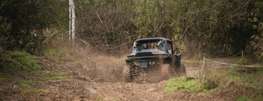 A Segway Powersports ATV offroading in the Alberta wilderness