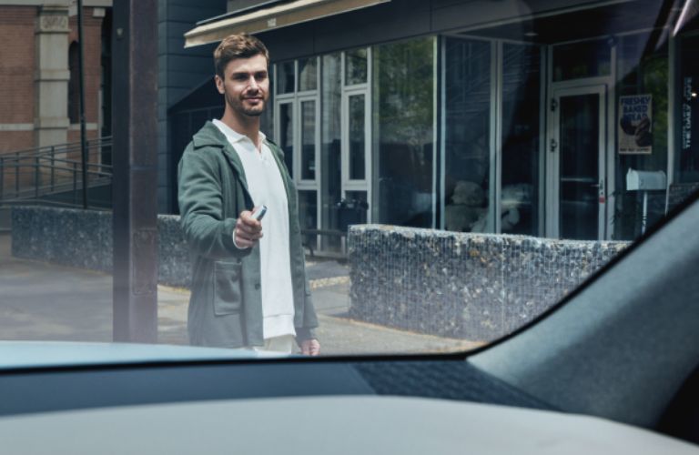 a man using his key for remote parking
