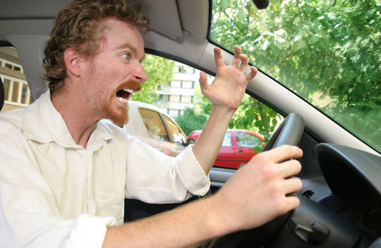 an angry man behind the wheel