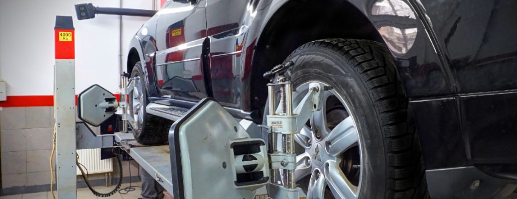 image of a car's wheels being aligned