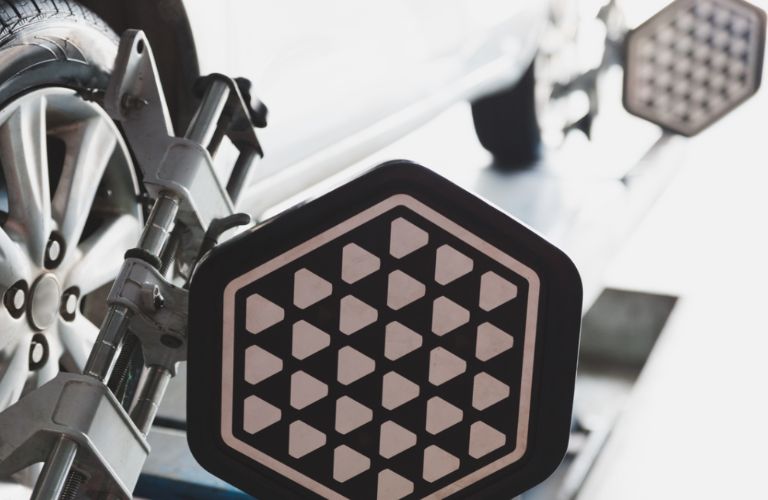 a car's wheel being aligned