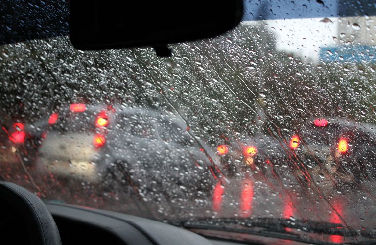 view of a windshield covered in rain drops