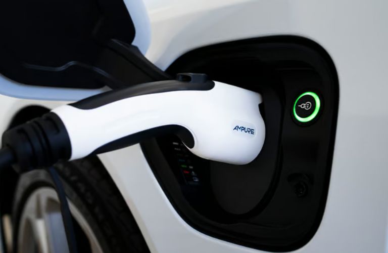 close up of a Kia EV getting charged