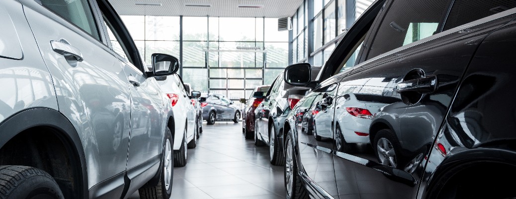 Partial view of sedans at a dealership
