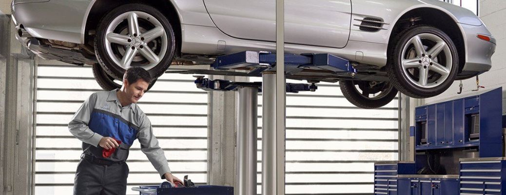 Technician checking vehicle