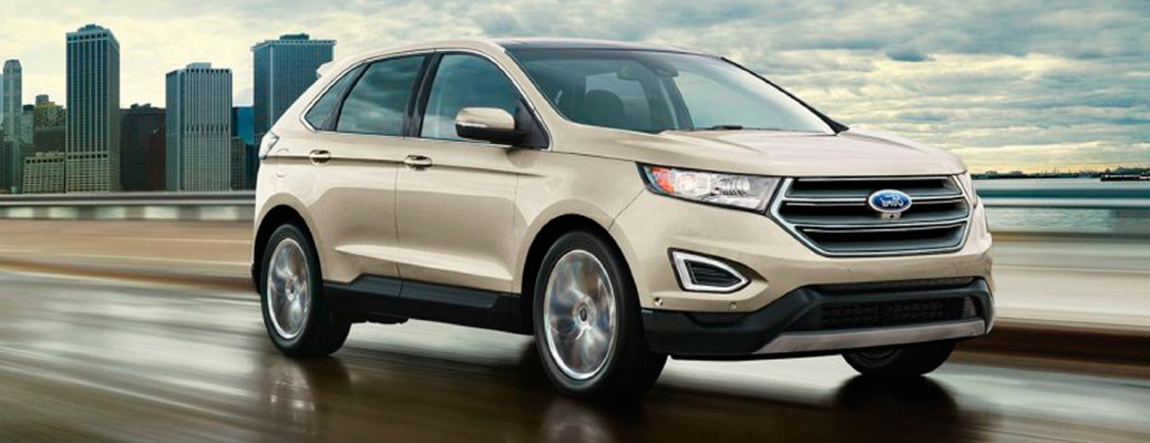 2017 Ford Edge driving away from a city
