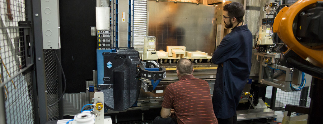 two people using a Ford 3D printer