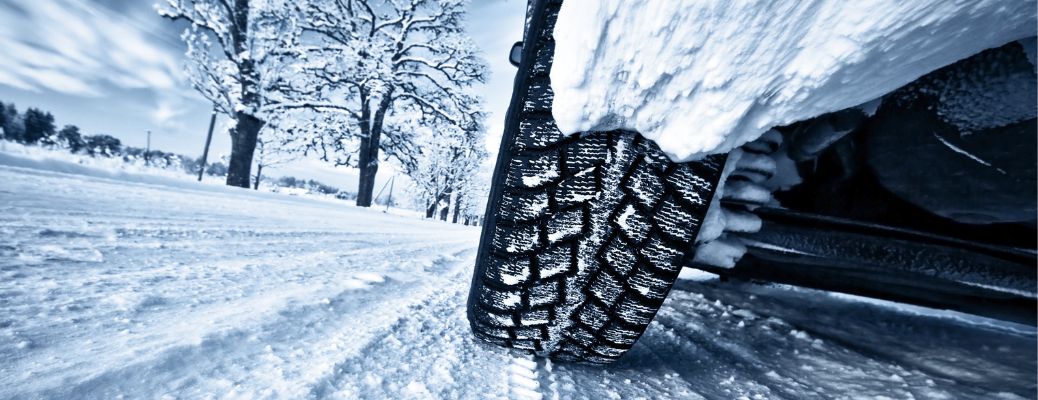 a vehicle tire driving in snow