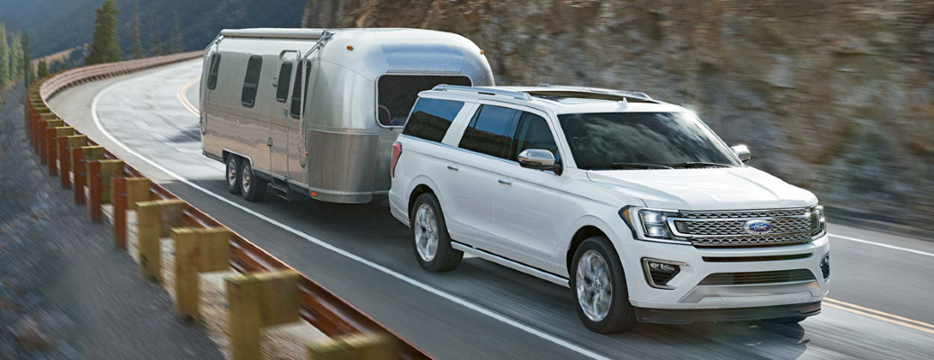 2018 Ford Expedition towing a trailer on a road
